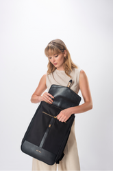 The Kimberly breast pump backpack under-flap zipper for small personal effects view